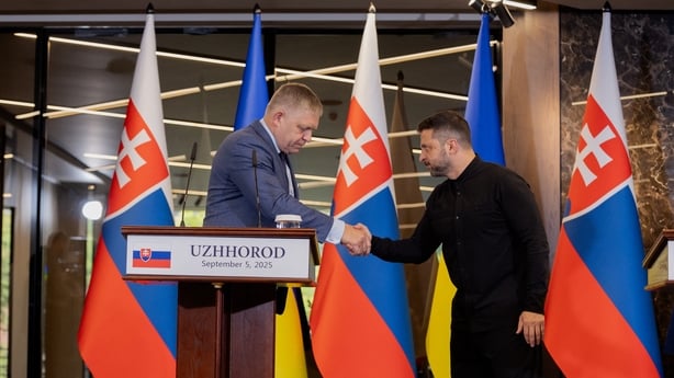 Ukraine's President Volodymyr Zelensky (R) shakes hands with Prime Minister of Slovakia Robert Fico
