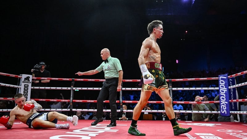 Michael Conlan returns to his corner as Jack Bateson receives the count