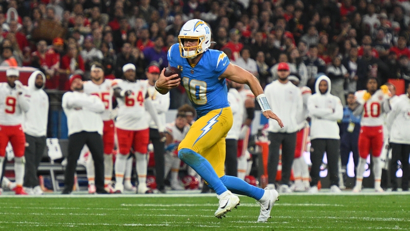 Justin Herbert bursts downfield for Los Angeles Chargers at Corinthians Arena in Sao Paulo