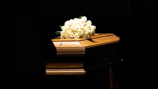 Giorgio Armani's coffin, topped with white roses, lies in the Mortuary Chapel at Armani Teatro in Milan, Italy