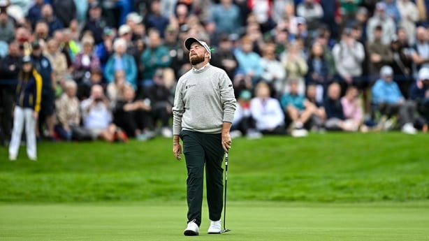 Shane Lowry of Ireland reacts to a missed putt on the 18th green