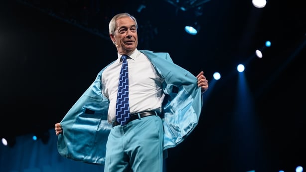 Leader of Reform UK Nigel Farage jokes with delegates towards the end of day one of the Reform UK party conference at National Exhibition Centre in Birmingham, England