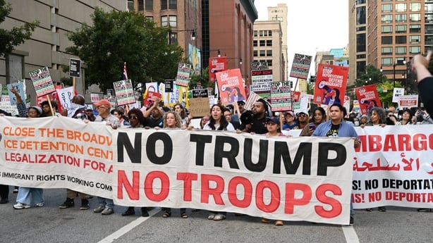 A group stand with signs