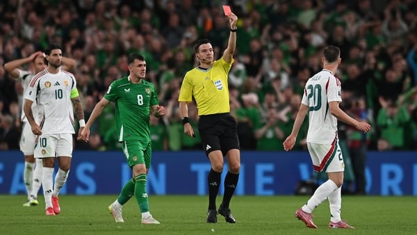 Referee Harm Osmers shows a red card to Roland Sallai of Hungary