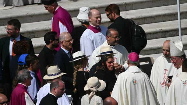 Mother of late Carlo Acutis wrapped in black shawl speaks to clergy