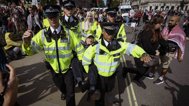 A protester is arrested and taken away by police for taking part in a gathering showing support for Palestine Action. Over a thousand people took part in the protest over the ban of the movement