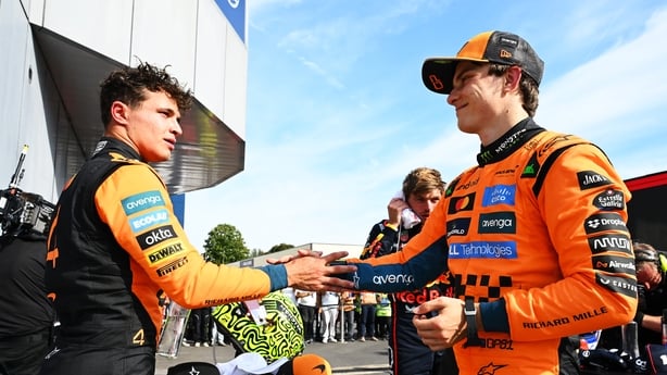 MONZA, ITALY - SEPTEMBER 07: Second placed Lando Norris of Great Britain and McLaren and Third placed Oscar Piastri of Australia and McLaren congralate each other in parc ferme during the F1 Grand Prix of Italy at Autodromo Nazionale Monza on September 07, 2025 in Monza, Italy. (Photo by Mark Sutton