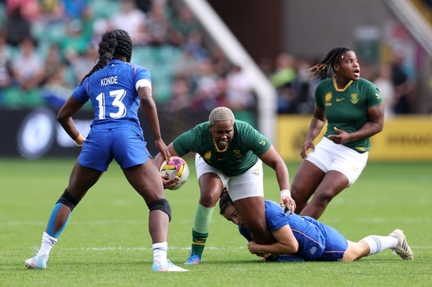 NORTHAMPTON, ENGLAND - SEPTEMBER 07: Aseza Hele of South Africa is tackled by Gaby Vernier of France during the Women's Rugby World Cup 2025 Pool D match between France and South Africa at Franklin's Gardens on September 07, 2025 in Northampton, England. (Photo by Morgan Harlow - World Rugby/World R