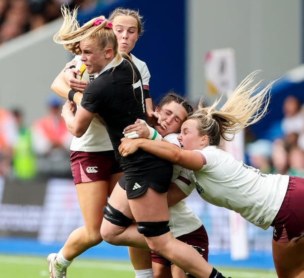 7 September 2025; Jorja Miller of New Zealand is tackled by Ireland players Aoibheann Reilly, Amee Leigh Costigan and Aoife Dalton during the Women's Rugby World Cup 2025 Pool C match between New Zealand and Ireland at Brighton and Hove Community Stadium in Falmer, England. Photo by Harry Murphy/Spo