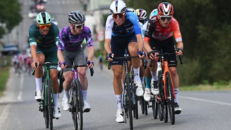 Eddie Dunbar (purple) races in the chase group during the stage 15 of the Vuelta from A Veiga-Vegadeo to Monforte de Lemos