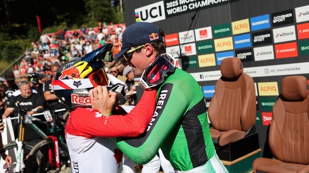 Gold medallist Jackson Goldstone of Canada embraces Ireland's bronze medallist Ronan Dunne in Valais