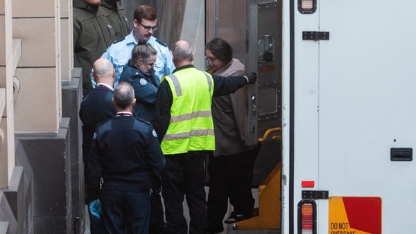 Erin Patterson being escorted into the Supreme Court of Victoria.