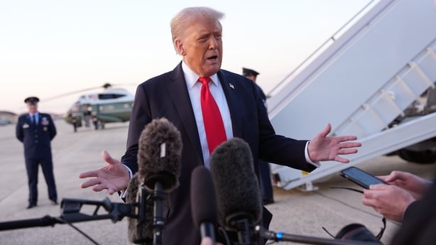 US President Donald Trump speaks to reporters after stepping off Air Force One at Joint Base Andrews in Maryland.