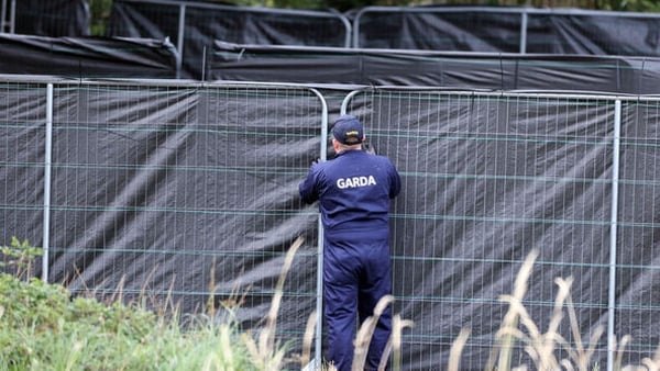 Photo shows Garda securing the fencing as they finish for the night at the scene in Donabate on Friday