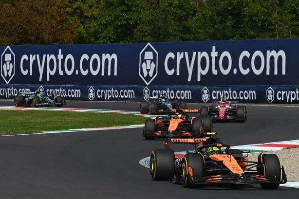 MONZA, ITALY - SEPTEMBER 07: Lando Norris of Great Britain driving the (4) McLaren MCL39 Mercedes leads Oscar Piastri of Australia driving the (81) McLaren MCL39 Mercedes and Charles Leclerc of Monaco driving the (16) Scuderia Ferrari SF-25 on track during the F1 Grand Prix of Italy at Autodromo Naz