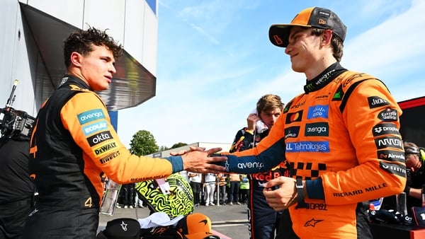 MONZA, ITALY - SEPTEMBER 07: Second placed Lando Norris of Great Britain and McLaren and Third placed Oscar Piastri of Australia and McLaren congralate each other in parc ferme during the F1 Grand Prix of Italy at Autodromo Nazionale Monza on September 07