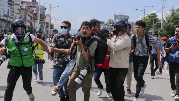 Nepali student protesters clash with police near the Federal Parliament building in Kathmandu