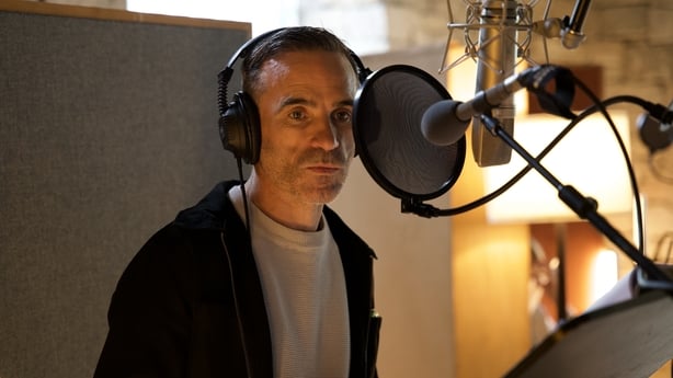 man recording a radio drama