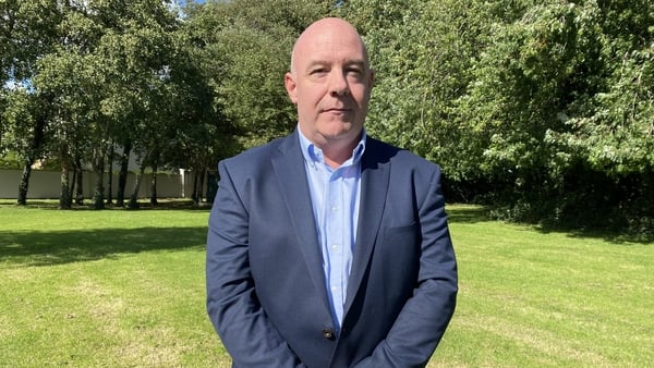David Hall, ex-Sonas boss, seen looking at the camera wearing a navy suit and blue shirt