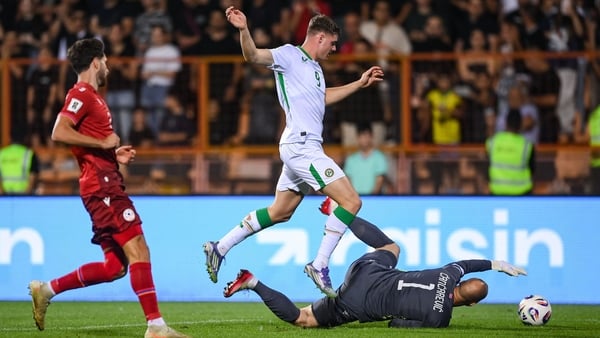 Evan Ferguson of Republic of Ireland is tackled by Armenia goalkeeper Ognjen Chancharevich - 2026 WC qualifier