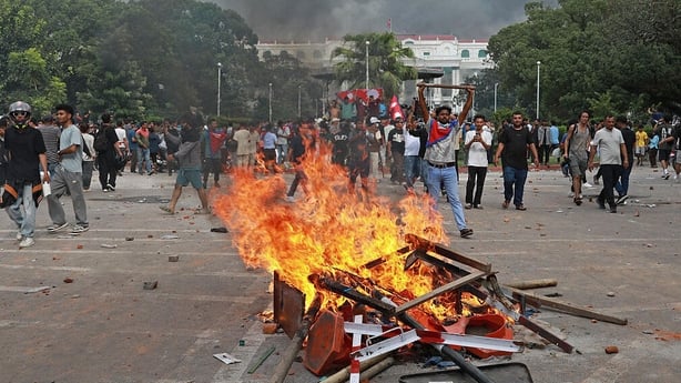 Protesters set alight a fire inside the premises of Singha Durbar, the main administrative building of the Nepal government