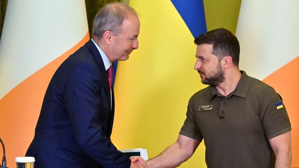 Ukrainian President Volodymyr Zelensky shakes hands with Ireland's Taoiseach Micheal Martin