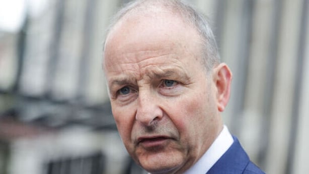 Taoiseach Micheál Martin talking to the media outside Government Buildings yesterday