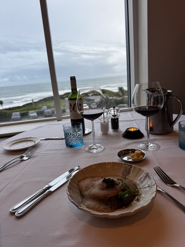 A plate of food overlooking the sea