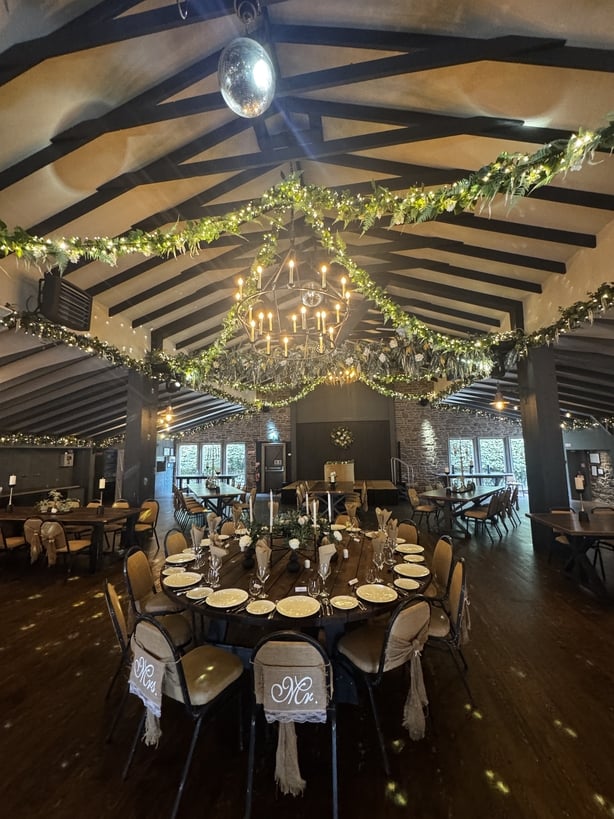 A reception room with fairy lights overhead