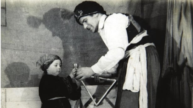 Sandy Kelly as a child and her father performing onstage