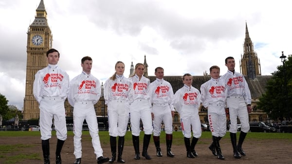 Jockeys Kieran Shoemark, Oisin Murphy, Saffie Osborne, Lily Pinchin, Richard Johnson, Hollie Doyle, Tom Marquand and Paul O'Brien (left-right) participate in an Axe The Racing Tax protest in Parliament Square, Westminster, London. British racing will come