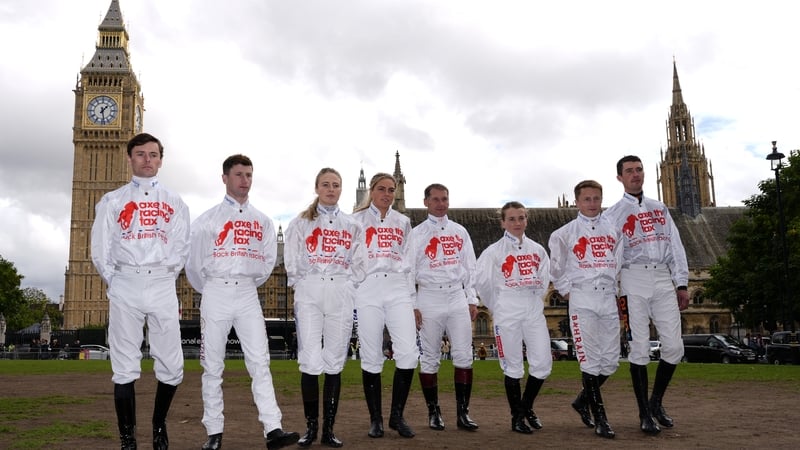 Jockeys Kieran Shoemark, Oisin Murphy, Saffie Osborne, Lily Pinchin, Richard Johnson, Hollie Doyle, Tom Marquand and Paul O'Brien (left-right) participate in an Axe The Racing Tax protest in Parliament Square, Westminster, London. British racing will come