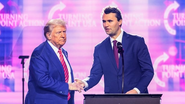 Donald Trump and Charlie Kirk on stage together in December last year