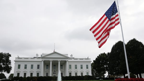 The US flag is lowered to half-mast outside the White House in Washington, DC