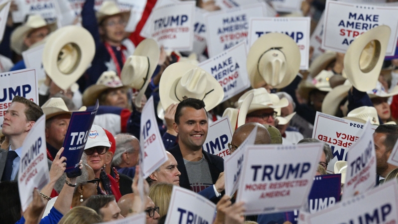 Charlie Kirk stands among attendees during Day 3 of the Republican National Convention on July 17, 2024 in Milwaukee.
