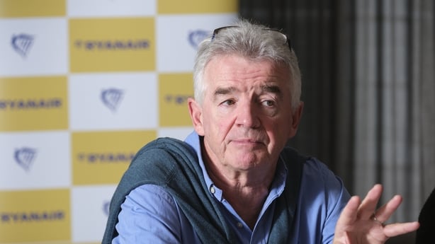Michael O'Leary, Ryanair CEO, pictured at a press event with the Ryanair logo on a screen behind him