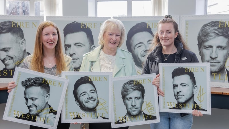 Westlife superfan Mary Anderson (centre) and her daughters Kate and Sarah at the launch of An Post's limited-edition Westlife 25 stamps at Sligo GPO on Thursday. Photo credit James Connolly