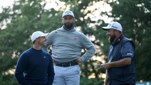 Rory McIlroy, Jon Rahm of Spain and Shane Lowry share a joke on day one at Wentworth Golf Club