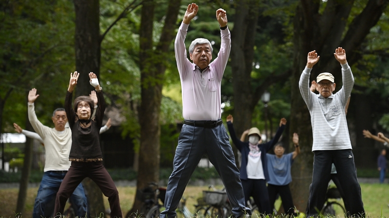 Elderly people exercise in a Tokyo park