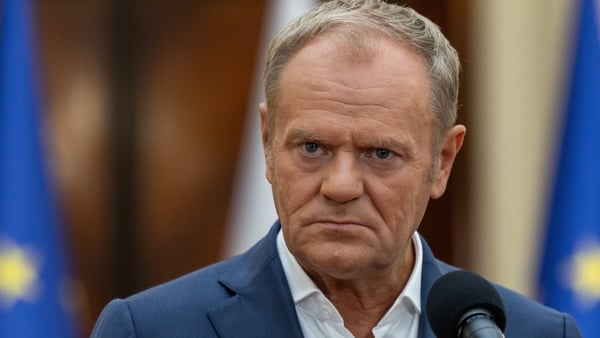 Poland's Prime Minister Donald Tusk reacts during the late evening press conference in government building after he attended in the National Security Council