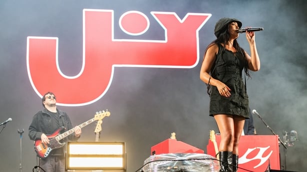 Joy Crookes performing onstage