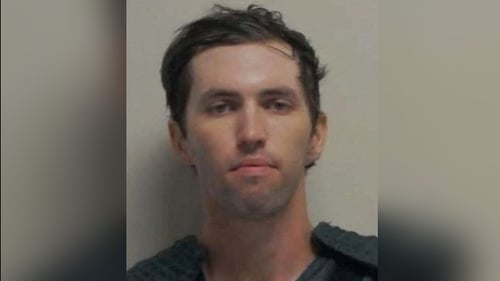 A police mugshot of 22-year-old suspect Tyler Robinson