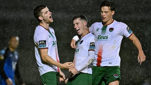 Darragh Crowley and Benny Couto flank Evan McLaughlin as the Cork City man celebrates his second goal of the night