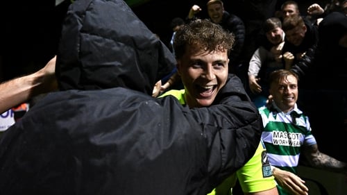 Shamrock Rovers goalkeeper Ed McGinty celebrates with supporters after the shootout