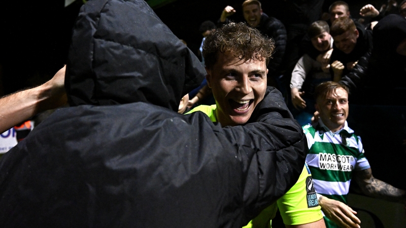 Shamrock Rovers goalkeeper Ed McGinty celebrates with supporters after the shootout
