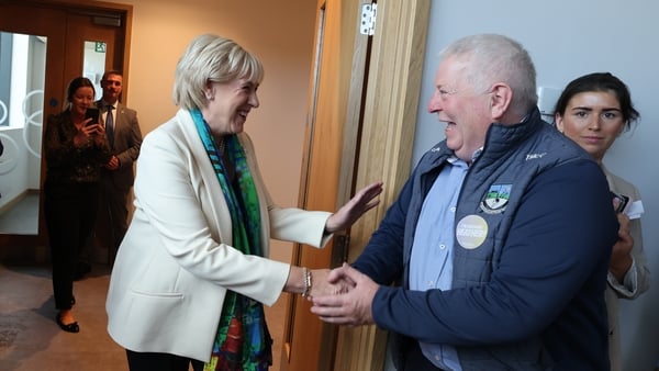 Heather Humphreys shakes hands with a man at the launch of her presidential campaign
