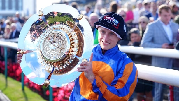 Marquand celebrates with a trophy