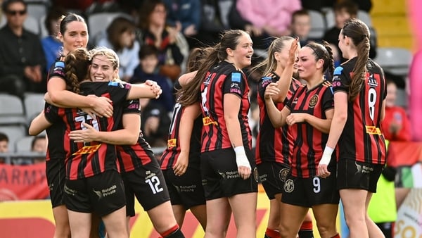 Bohemians players celebrate after their side's second goal scored by Katie Lovely, hidden, during the Sports Direct Women's FAI Cup semi-final match between Bohemians and Treaty United at Dalymount Park in Dublin.