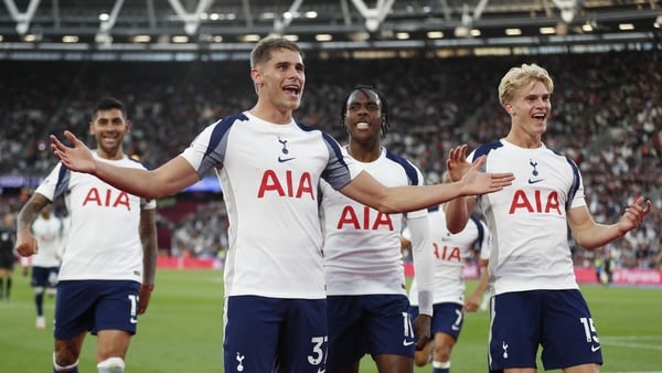 Micky van de Ven (C) celebrates scoring their third goal