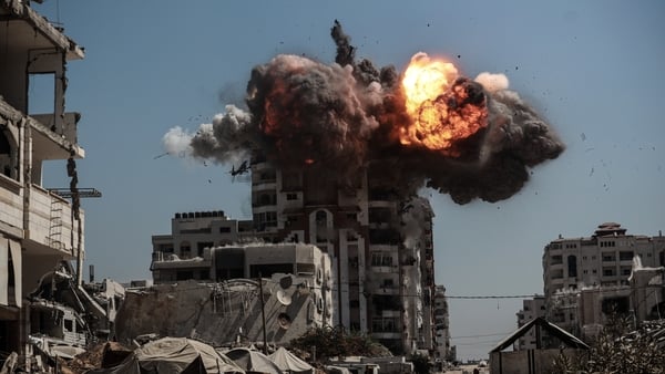 Smoke rises following Israeli airstrikes that hit and destroyed multiple buildings and high-rise towers in Gaza City